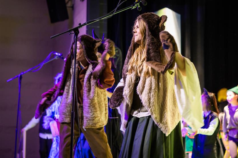 Students perform onstage